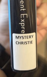 A closeup of the spine on the book "Murder on the Orient Express," focusing on the spine label. The spine label reads "MYSTERY CHRISTIE."