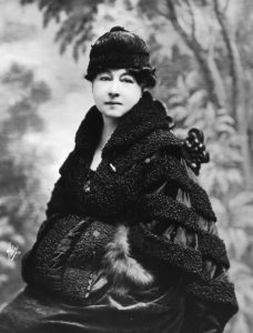 A black and white portrait of Alice Guy-Blache