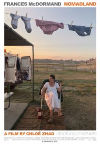 Poster for Nomadland. The poster shows a woman sitting in a chair in a nightgown in an almost empty field